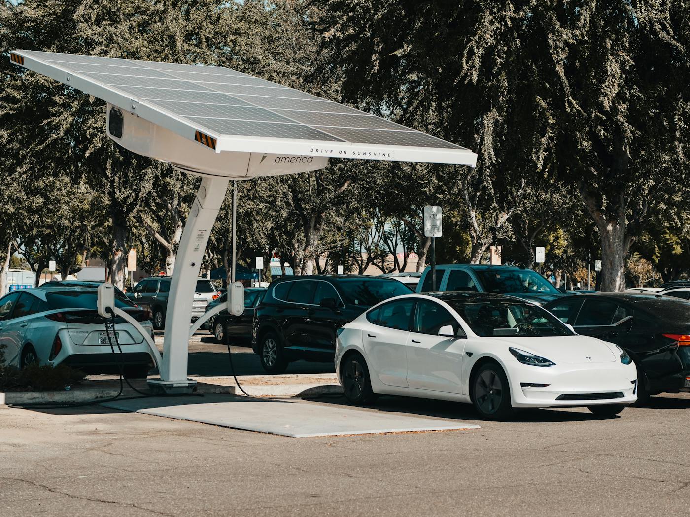 Solar EV charging canopy with an electric vehicle